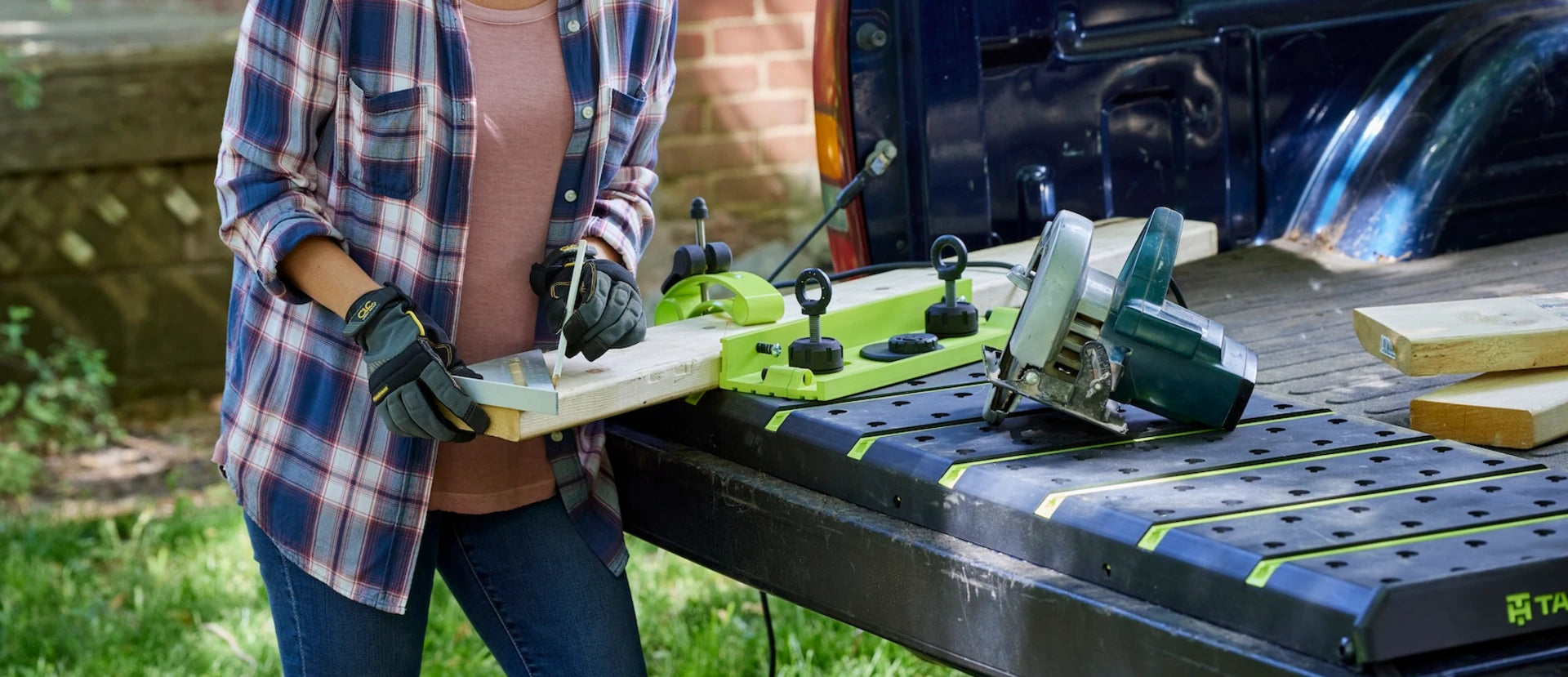 TailHand truck tailgate workstation with T-tracks and dog holes for bench dog tools